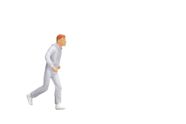 Miniature people running isolated on white background with clipping path