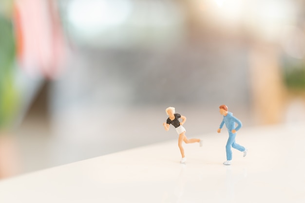 Miniature people running 
