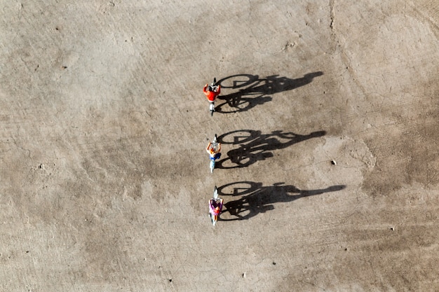 Miniature people: Travelers riding bicycle 