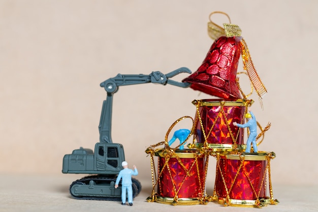 Miniature people,  Worker team working with a Christmas decoration