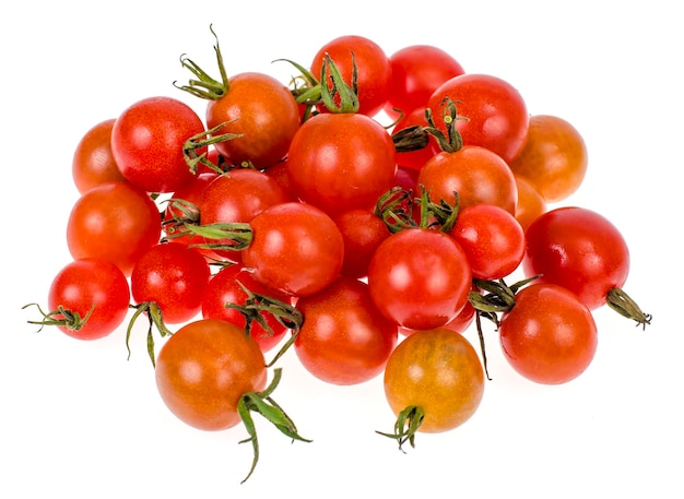 Miniature red cherry tomatoes on white background, vegetarian and vegetable products. 

