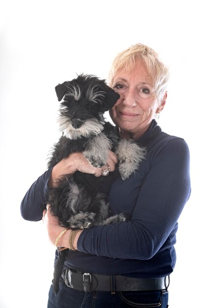 Miniature schnauzer and woman in studio