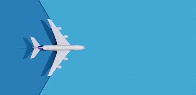 Miniature toy airplane on colorful paper background