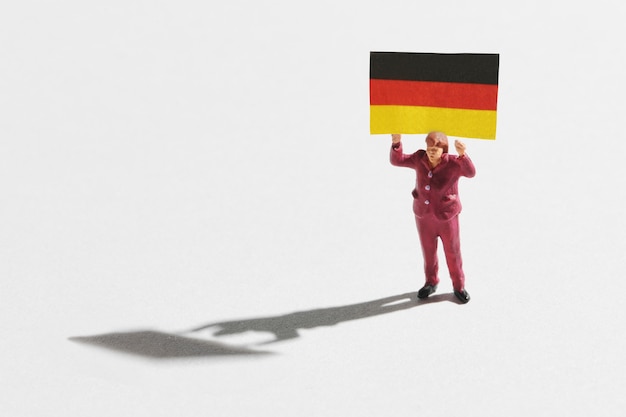 Miniature woman with German flag