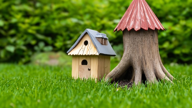 A miniature wooden garden gnome house in the middle of a rich green garden The house AI Generative