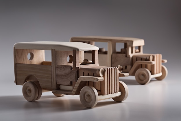 Miniature wooden retro bus in the studio.