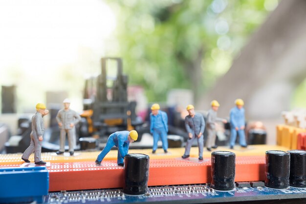 Miniature worker repairing circuit motherboard