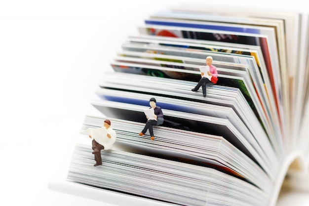 miniatures people reading with book, education or business concept