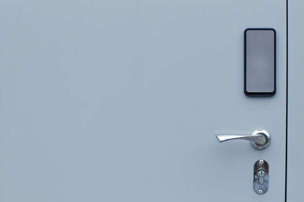 Minimal background image of metal door with electronic lock in
storage unit copy space