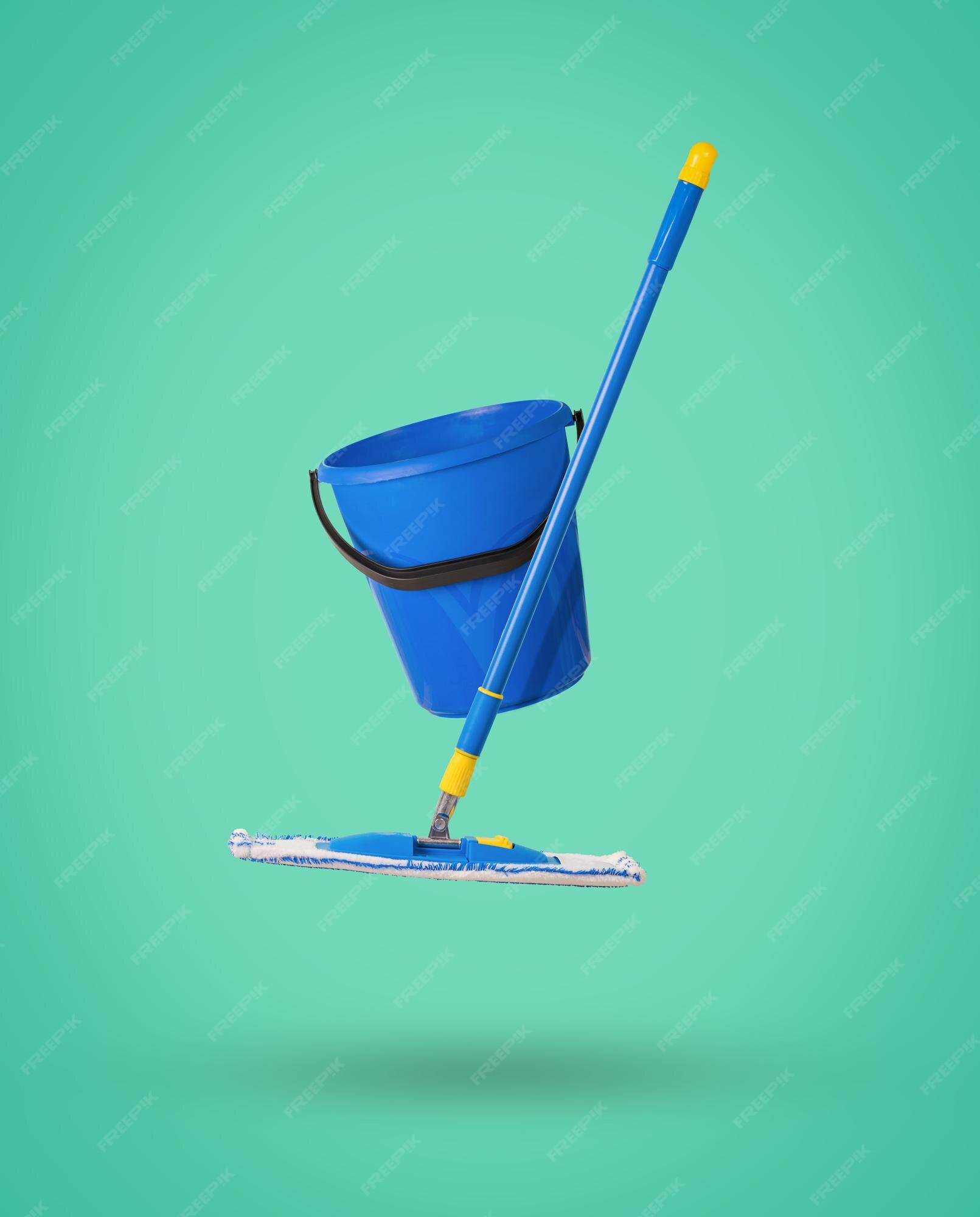 Premium Photo | Minimal cleaning concept a blue floor mop and a blue bucket  levitating on a green background the concept of cleaning the premises