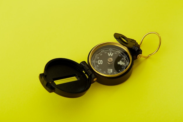 Minimal Compass on bright yellow background