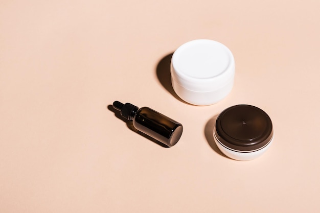 Minimal composition of natural cosmetic products. Isometric view, hard shadows and copy space.