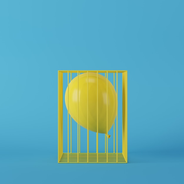 Minimal concept yellow balloon floating in yellow cage on blue background 