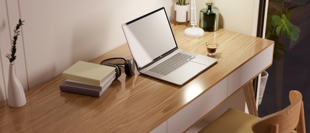 A minimal cozy home workspace with laptop mockup on wooden table