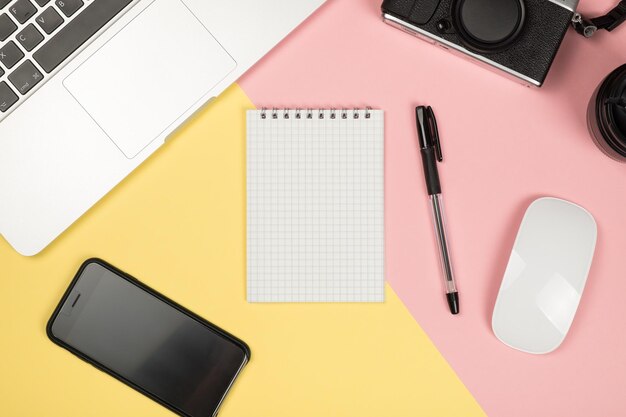 Minimal flat lay style picture of blank notebook page with different objects