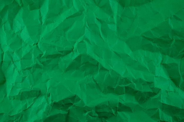 Minimal green crumpled paper texture background for Design