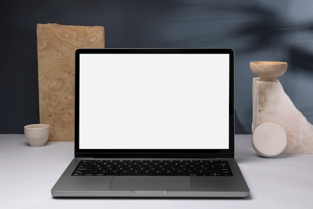minimal laptop and rocks arrangement