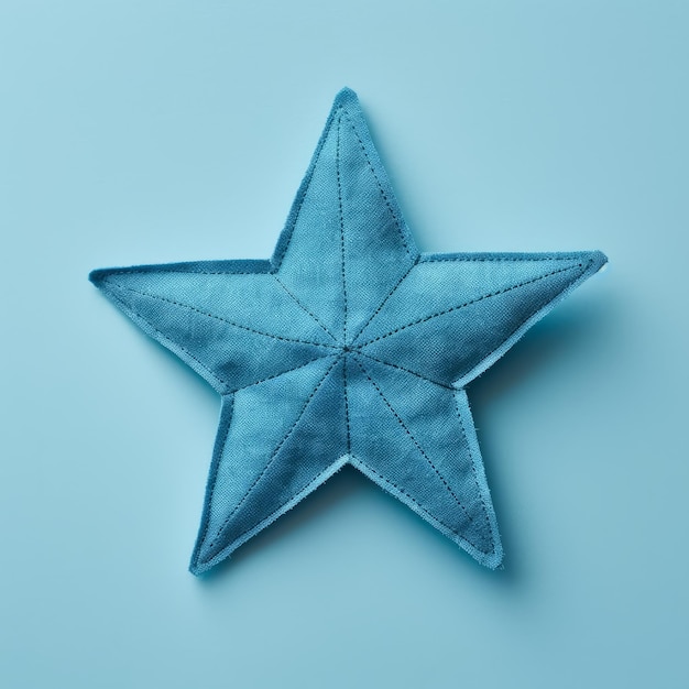 Minimal Retouching Sculpted Blue Star With Fabric Applique On Blue Background