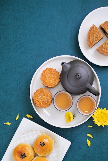 Minimal simplicity layout moon cakes on blue background for MidAutumn Festival creative food design concept top view flat lay copy space