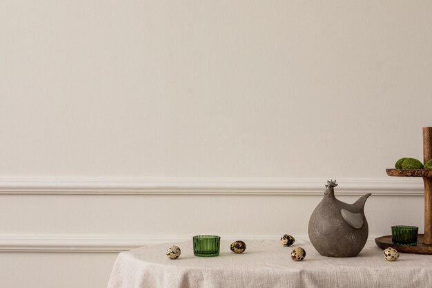 Photo minimal spring composition of easter living room interior with copy space beige wall with stucco hen