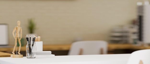 Minimal study table with stationery decor and copy space over blurred Scandinavian working room