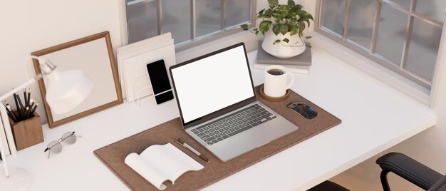 Minimal working space with laptop mockup book stationery and decor on tabletop above view