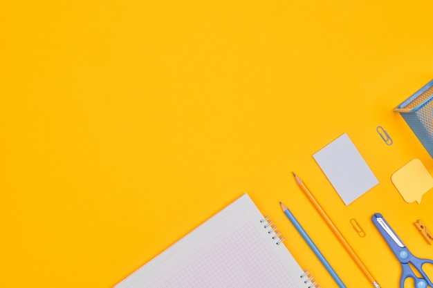 Photo minimalism yellow-blue stationery on yellow background