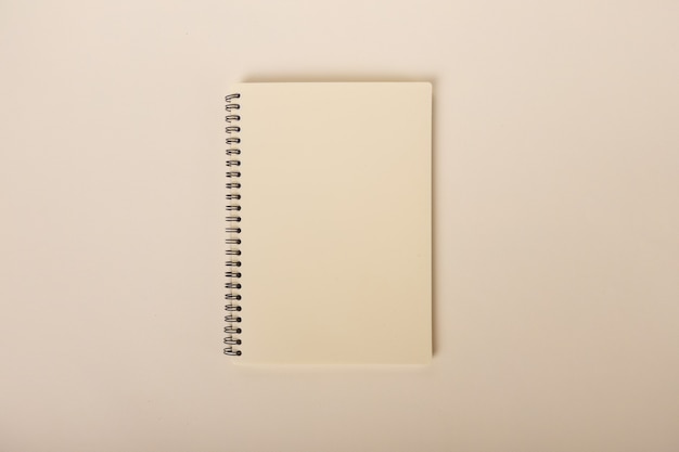 Minimalist beige notebook on a beige background top view educational supplies school subjects high q...