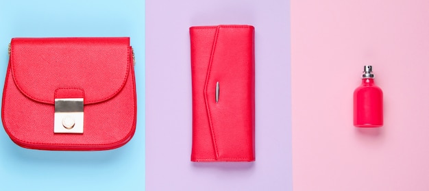 Minimalist fashion. Women's red fashion accessories. Leather purse, bag, perfume bottle. Top view