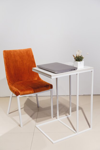 Minimalist lifestyle laptop on coffee table side view with copy space in background