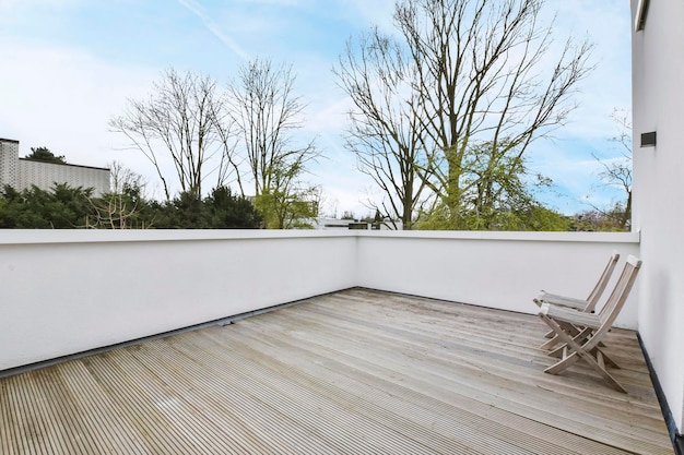 Minimalist style balcony with wooden floor