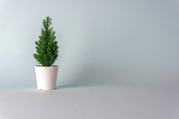 Minimalistic Christmas tree on a blue background. 