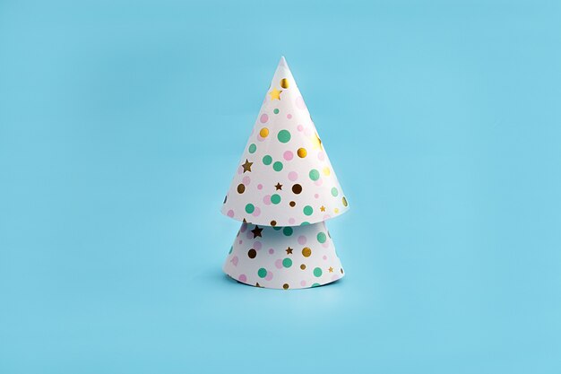 Minimalistic Christmas tree made of Colorful Hats for Party.