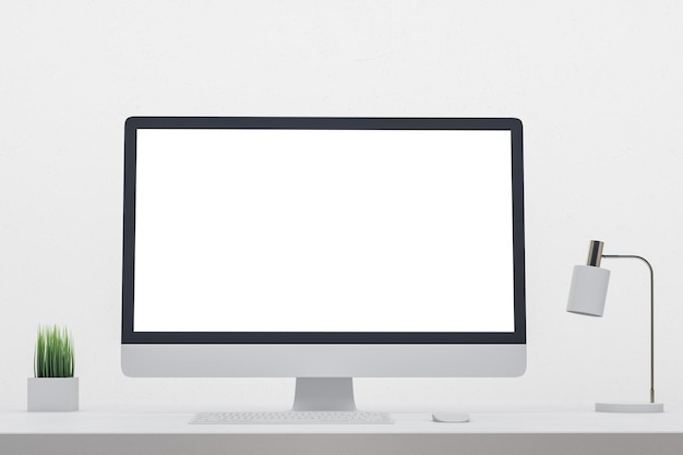 Minimalistic designer desk with empty computer screen