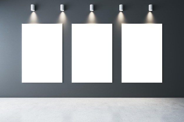 Minimalistic gallery interior with lamps on ceiling and three blank banners