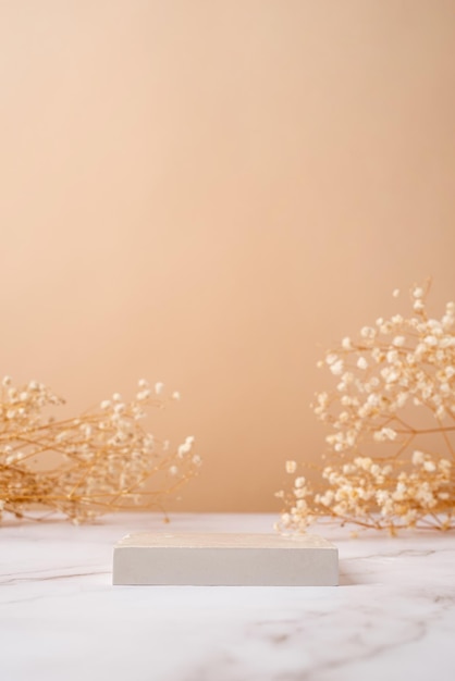 Photo a minimalistic scene of a podium with gypsophila flowers on a light beige background