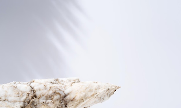 A minimalistic scene of stone marble podium on white background for natural cosmetics