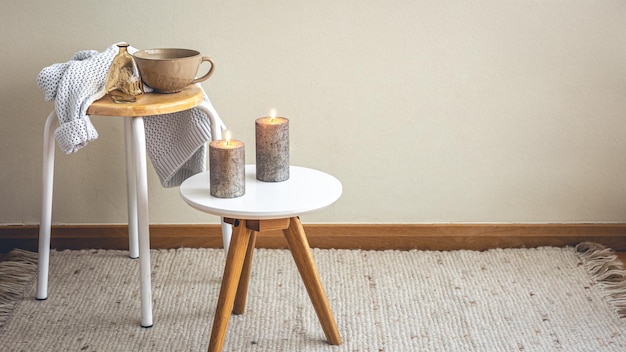 Minimalistic still life with candles in the interior of the room