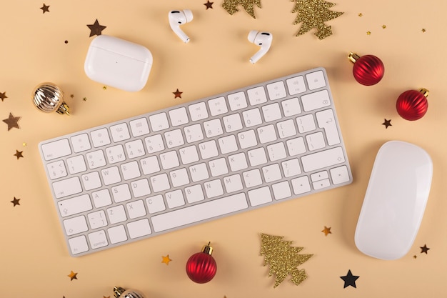 Minimalistic Stylish workplace among Christmas decorations on a neutral background Top view layout