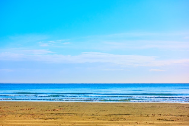 Minimalistic view of empty sandy beach and sea horizon