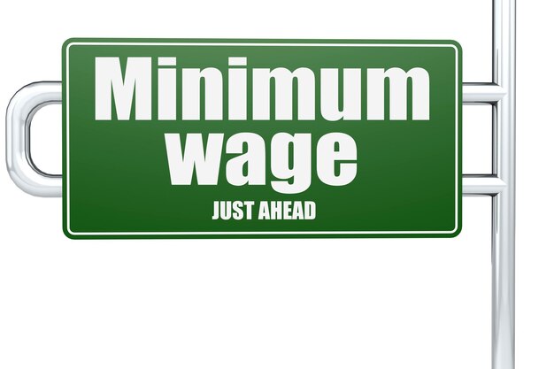 Minimum wage word on green road sign