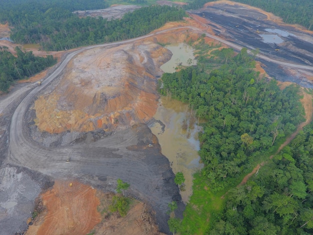 mining activities, coal getting, hauling and loading at a coal mining Project. Aerial view.