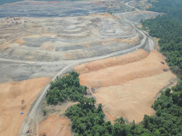 mining activities, coal getting, hauling and loading at a coal mining Project. Aerial view.