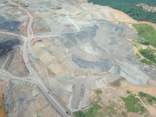 mining activities, coal getting, hauling and loading at a coal mining Project. Aerial view.