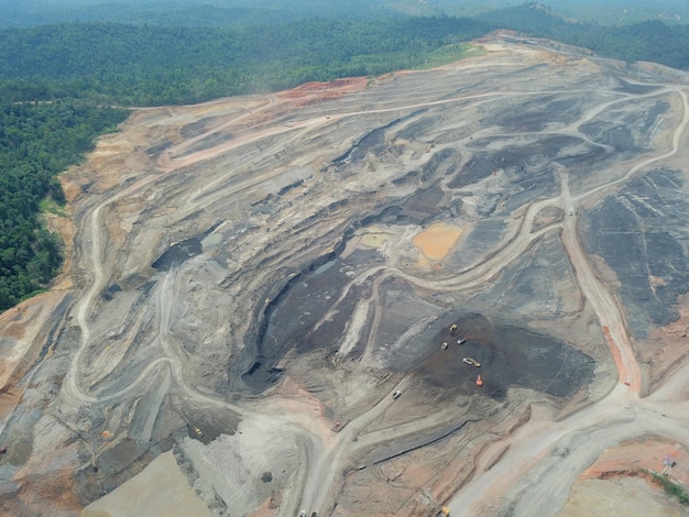 mining activities, coal getting, hauling and loading at a coal mining Project. Aerial view.