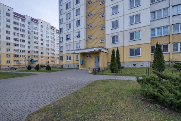 MINSK BELARUS AUGUST 2020 view of residential area with multistorey skyscraper building and and improved courtyard area