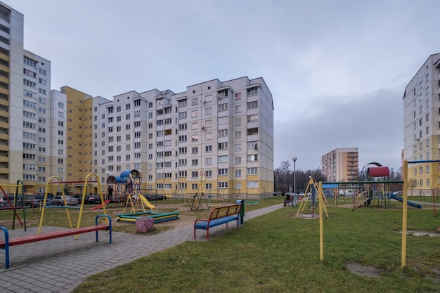 MINSK BELARUS AUGUST 2020 view of residential area with multistorey skyscraper building and and improved courtyard area