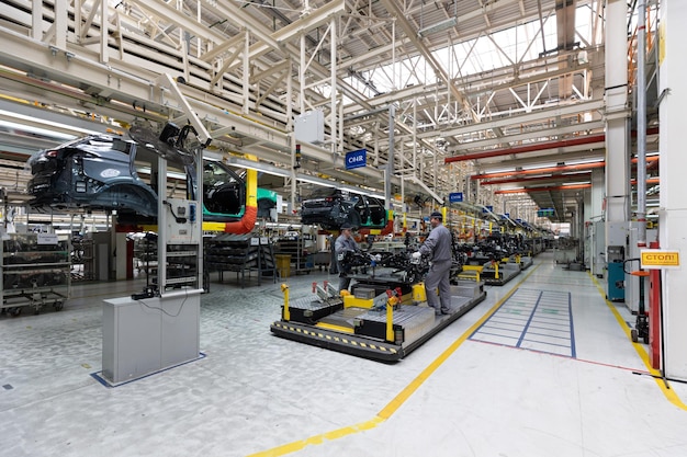 Minsk Belarus Dec 15 2021 Photo of car bodies are on assembly line Factory for production of cars Modern automotive industry