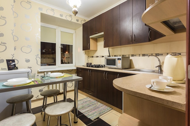 MINSK BELARUS DECEMBER 8 2017 Interior of the modern kitchen in loft flat in light color style with fruits