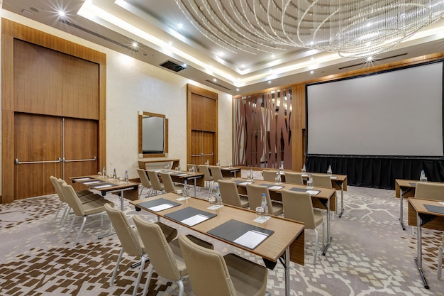 MINSK BELARUS JULY 2017 rows of seats in interior of modern empty conference hall for business meetings